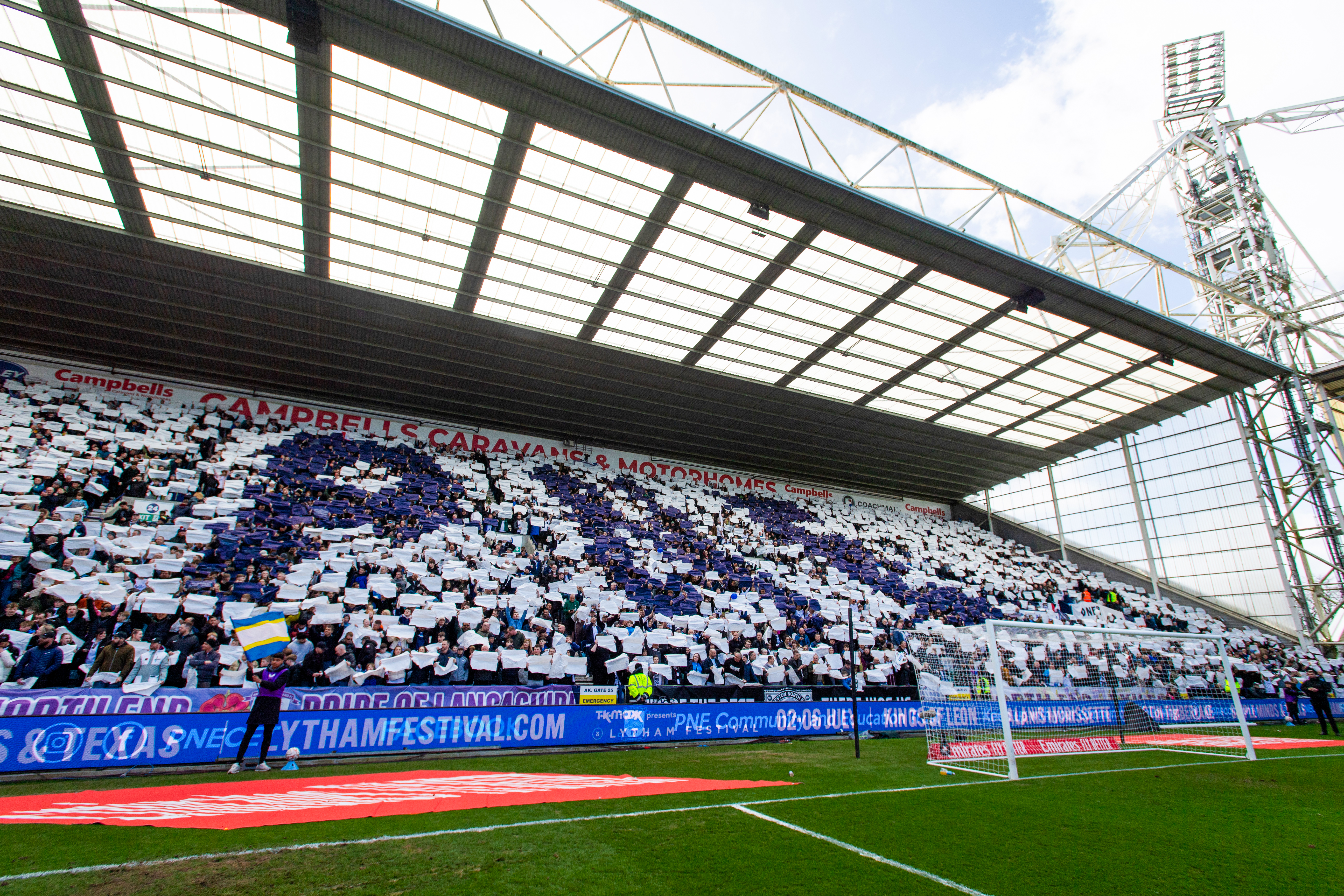 PNE supporters waving flags at Deepdale (slide 1)